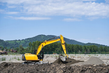 Demolition constuction. Excavator machine build road at mountain. Earthwork truck operator. Manzherok view. House development