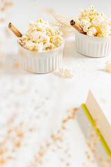 Cozy and aesthetic beige composition with popcorn. Autumn, winter food concept.