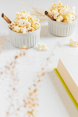 Cozy and aesthetic beige composition with popcorn. Autumn, winter food concept.