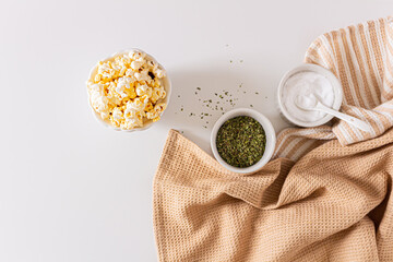 Cozy and aesthetic beige composition with popcorn. Autumn, winter food concept.