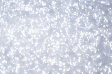 Bokeh circle with silver sparkles background. Grey glitter backdrop. Monochrome texture. New year luxury snow. Copyspace. Shimmer confetti wallpaper. Dreamy shiny design detail