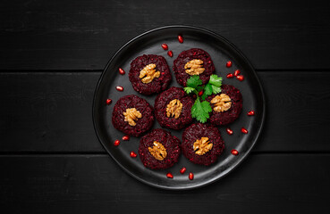 Traditional Georgian dish, beetroot phali, on a wooden table, horizontal, no people,