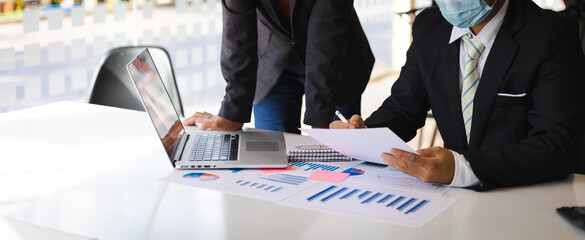 Businessmen working to discuss business planning strategies.