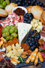 assorted cheeses and meats, vertical top view