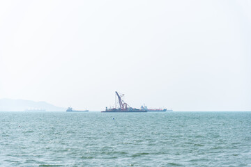 Nature in twilight period which including of sunrise over the sea and the nice beach. Summer beach with blue water and purple sky at the sunset.	
