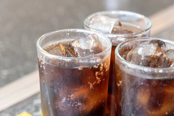 Refreshing Bubbly Soda Pop with Ice Cubes. Cold soda iced drink in a glasses - Selective focus, shallow DOF.	
