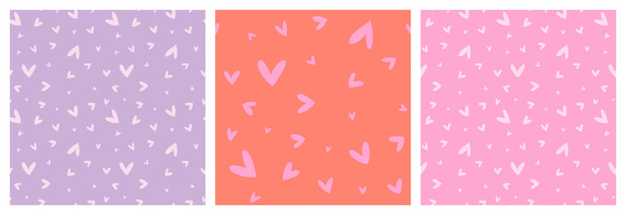 Heart non directional seamless pattern set in pink, lilac and orange girly colours. Hand drawn love symbols vector repeat backgrounds.