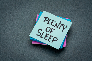 plenty of sleep, handwriting on a reminder note, healthy lifestyle concept