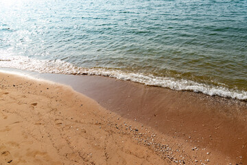 Nature in twilight period which including of sunrise over the sea and the nice beach. Summer beach with blue water and purple sky at the sunset.	
