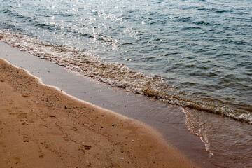 Nature in twilight period which including of sunrise over the sea and the nice beach. Summer beach with blue water and purple sky at the sunset.	
