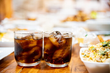 Refreshing Bubbly Soda Pop with Ice Cubes. Cold soda iced drink in a glasses - Selective focus, shallow DOF.	
