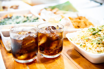 Refreshing Bubbly Soda Pop with Ice Cubes. Cold soda iced drink in a glasses - Selective focus, shallow DOF.	
