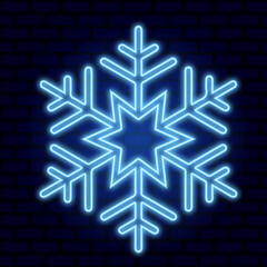 Neon snowflake on the background of a brick wall