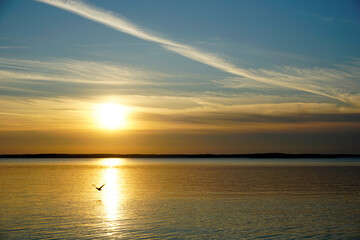 Obraz premium Autumn landscape. Sunset over the lake in October. Quiet clear evening. Expanse horizon reflection