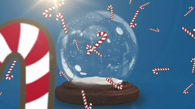 Multiple candy cane icons falling over shooting star spinning around snow globe on blue background