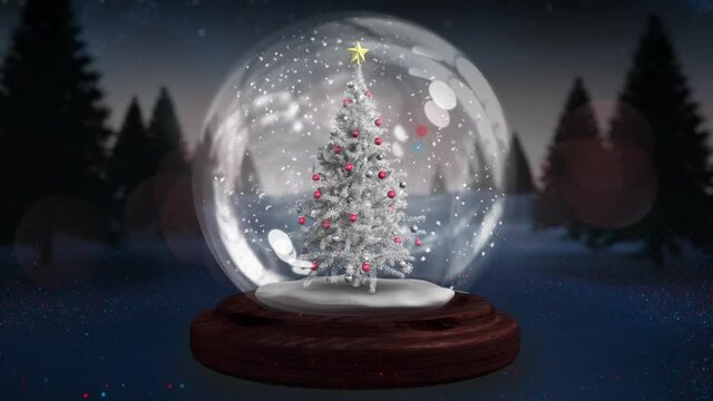 Two shooting stars spinning around christmas tree in a snow globe on winter landscape
