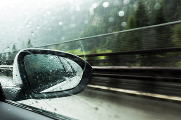 car driving through the rain