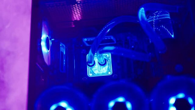 Gaming computer with water cooling blue color lights inside the case 4K