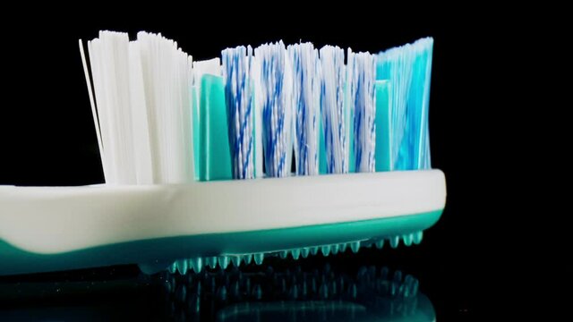 macro toothbrush, traveling slow motion.