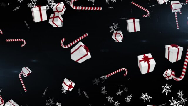 Multiple christmas gifts and candy cane icons falling against snowflakes floating on blue background