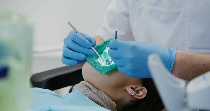 Filling the root canal of a patient's tooth.