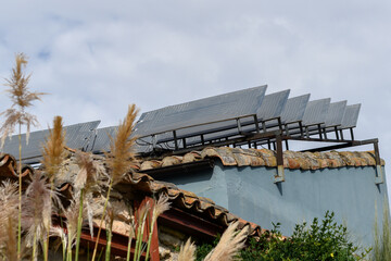 Thermal panels on the roof of a village house