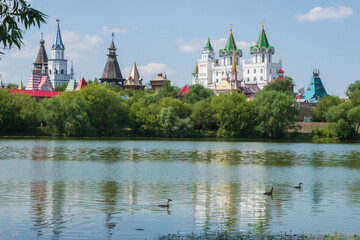 Fototapeta premium Castle Kremlin in Izmailovo and its reflection in the Serebryano-Vinogradny pond in Moscow, Russia
