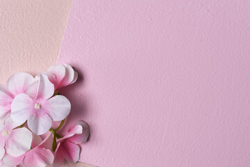 Fototapeta na wymiar wedding background in pastel colors, sparkling decorative glowing stones, flowers on pink background, framing, wedding card.