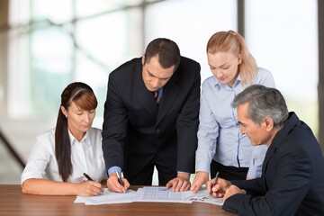 Happy motivated business leader talking to team, meeting with employees, managers.