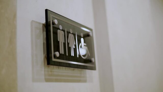 sign toilet for women men and disabled