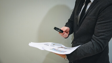 Young business man and digital number of stock market background to represent successful in...