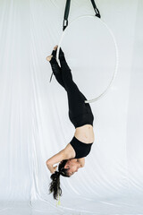 Portrait of an athlete in the air ring or aerial hoop practice in studio © somchairakin