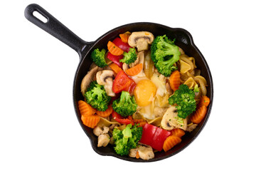 Pasta with steamed vegetables in a pan, organic food, isolated on white background.