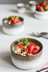 Strawberry, cream cheese and feta cream and crumble crust dessert. Homemade Sweet and salty cheesecake. Trifle. Selective focus