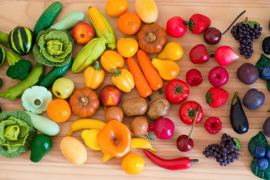 fruit and vegetables arranged as a rainbow