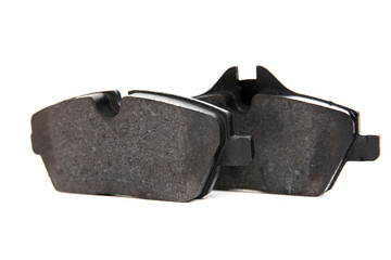 two new brake pads on a white background