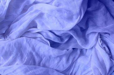 Delicate blue fabric with beautiful pleats. Silk, satin are folded freely. It can serve as a background for the inscription.