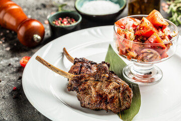 Organic Grilled Lamb Chops with vegetable salad with tomatoes, Restaurant menu, dieting, cookbook recipe