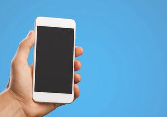 Male hand holding a smartphone with a blank screen
