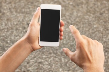 Man using mobile phone with a blank screen