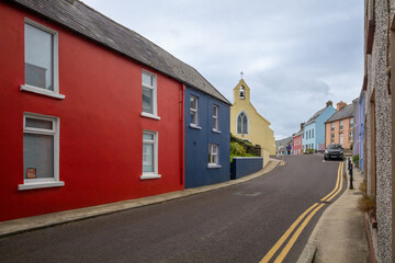 Fototapeta na wymiar Colourful Buildings and Church in Town of Eyeries, County Cork
