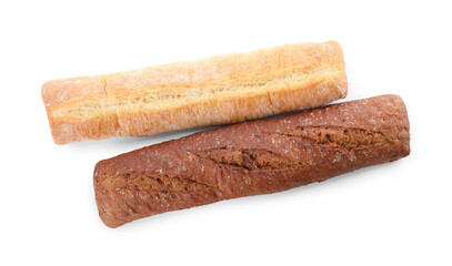 Different tasty baguettes on white background, top view. Fresh bread