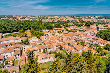 Fototapeta na wymiar Panoramic View of medieval citadel Carcassonne from the castle walls of Carcassonne town. Ancient historical monuments of Europe on the South of France.