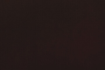 Dark non-uniform paper with spots and inclusions.