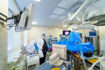 In advanced operating room with lots of equipment. Professional emergency operating room.