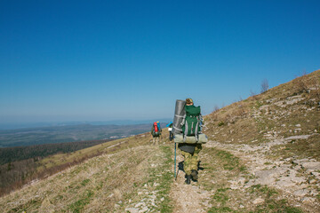 a group of people goes hiking with backpacks, Caucasus