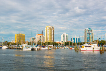 Modern city skyline including Parkshore Plaza and yachts at bayfront pier, viewed from Demens...