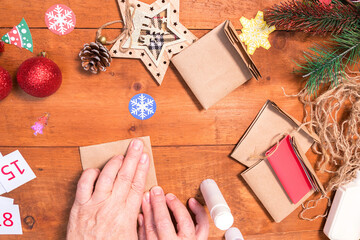 Fototapeta na wymiar Step 7. Step by step photo instruction. DIY concept. How to make an Advent calendar. Merry Christmas. creative ideas for children. crafts for children.