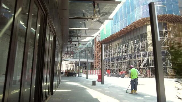 Kuala Lumpur, Malaysia - Sept 25, 2021 POV walking through the busy mall construction. 4K Slow-motion.