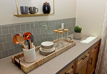 Kitchen Wicker Basket With Utensils, Dishes And Glass Decanters